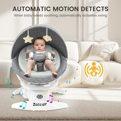 Baby in a gray baby swing with text about automatic motion detection, sitting on a beige couch.