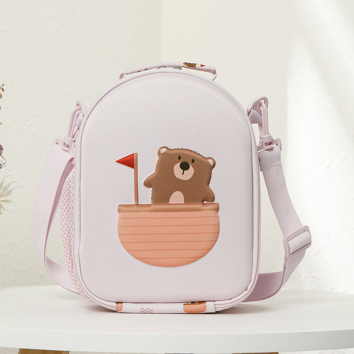 Children's backpack with bear design on a light background