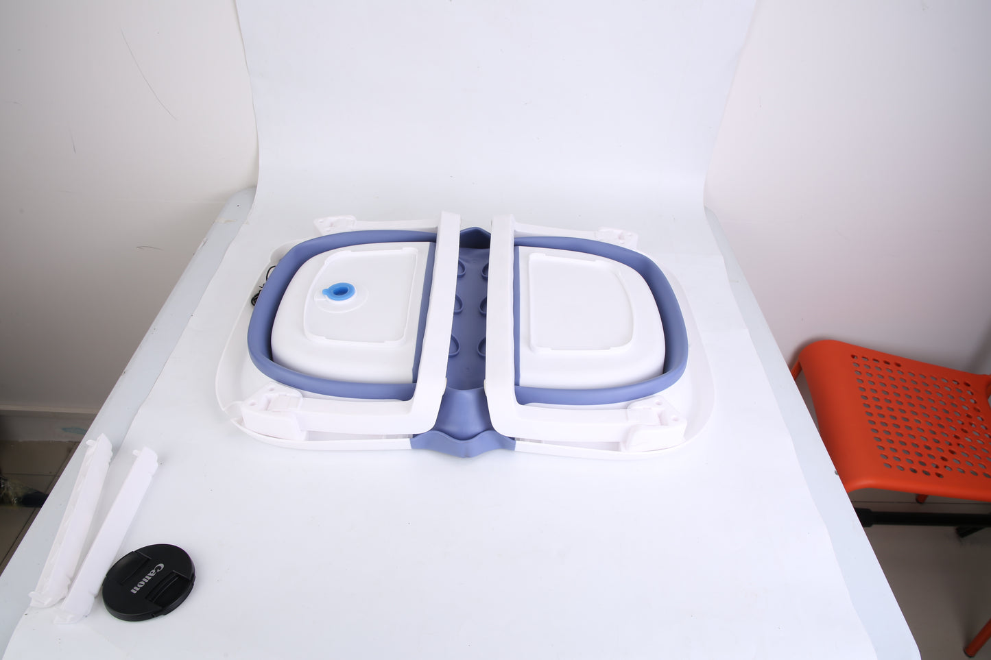 White appliance with blue accents on a white background