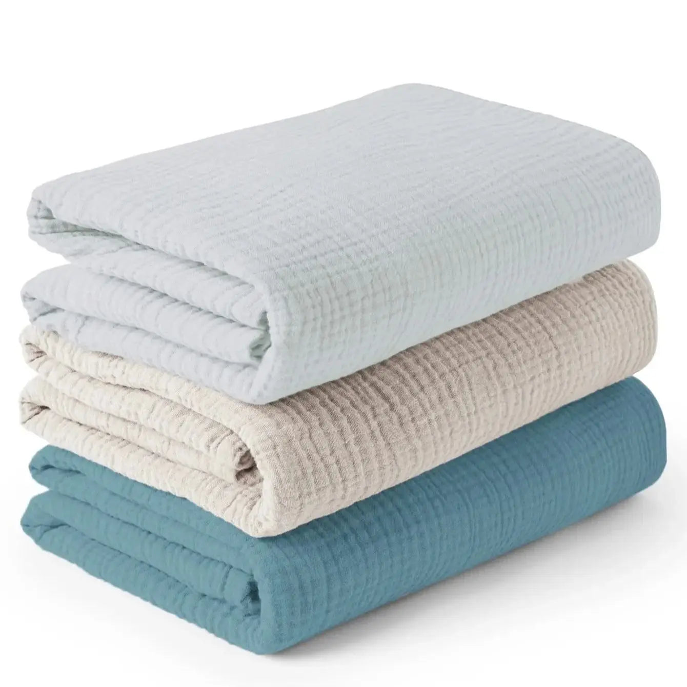 Stack of three folded textured blankets in light blue, beige, and teal on a white background