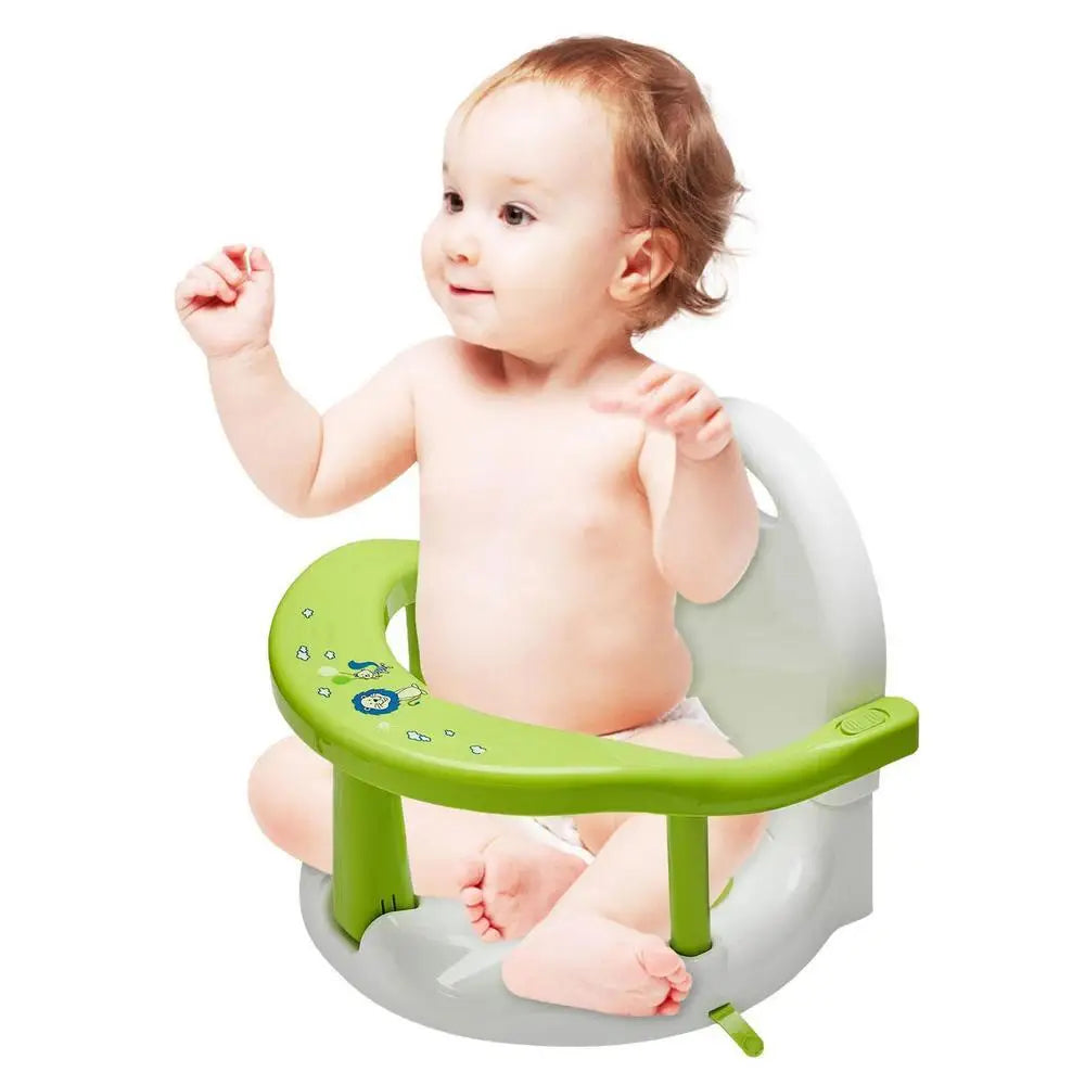 Baby sitting on a green and gray bath seat against a white background