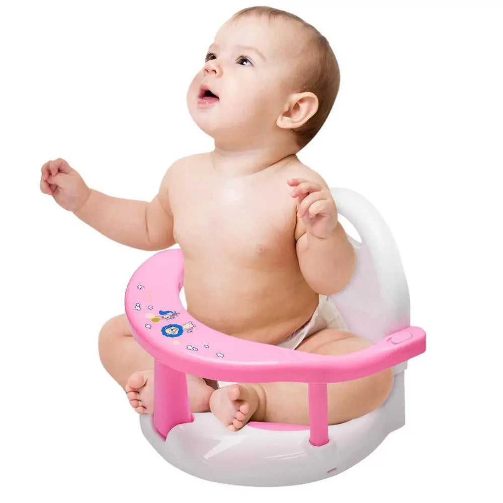 Baby sitting on a pink and white potty seat with cartoon characters on a white background