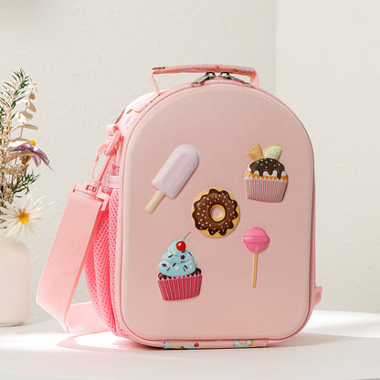 Pink lunch bag with dessert-themed decorations on a light background
