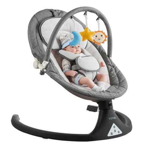 Baby in a gray baby swing with colorful stars on a white background